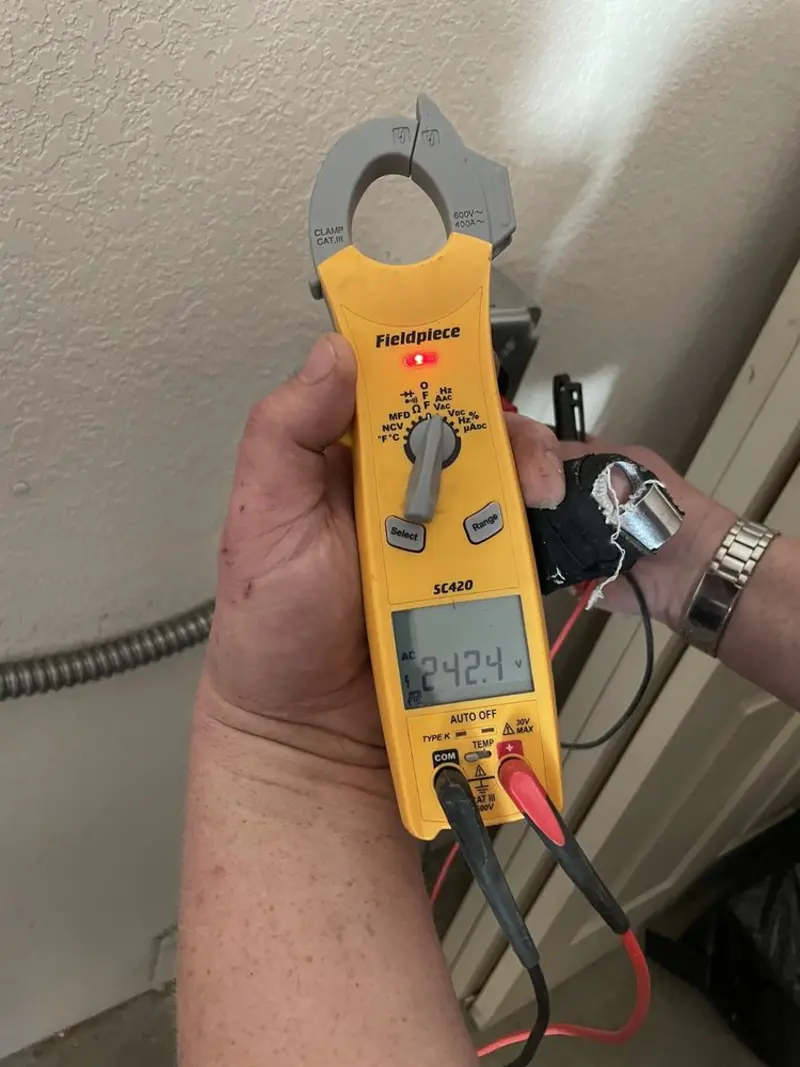 Voltage testing with clamp meter during Circuit Breaker Repair in Le Sueur
